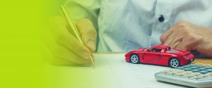 Man signing car loan agreement contract