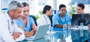 Doctors working on computers