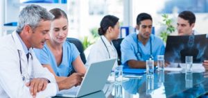 Doctors working on computers